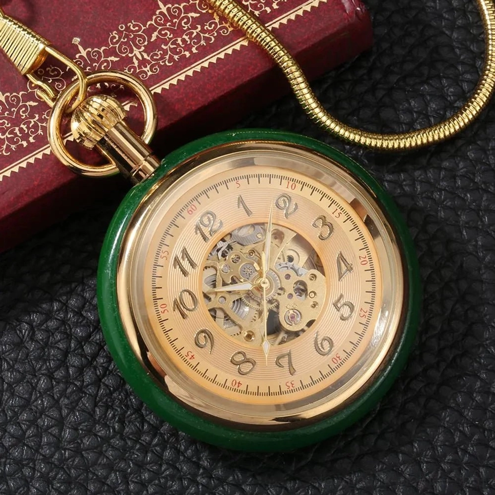 Golden steampunk pocket watch with serpent chain, oblique angle view showing skeleton dial and ornate hardware
