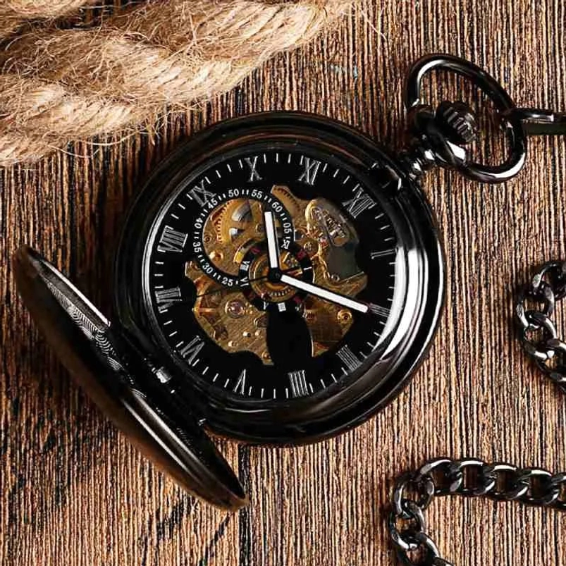 Flip-cover mechanical steampunk pocket watch with openable black metal case, Roman numeral dial, and visible gold skeleton movement from top-down view