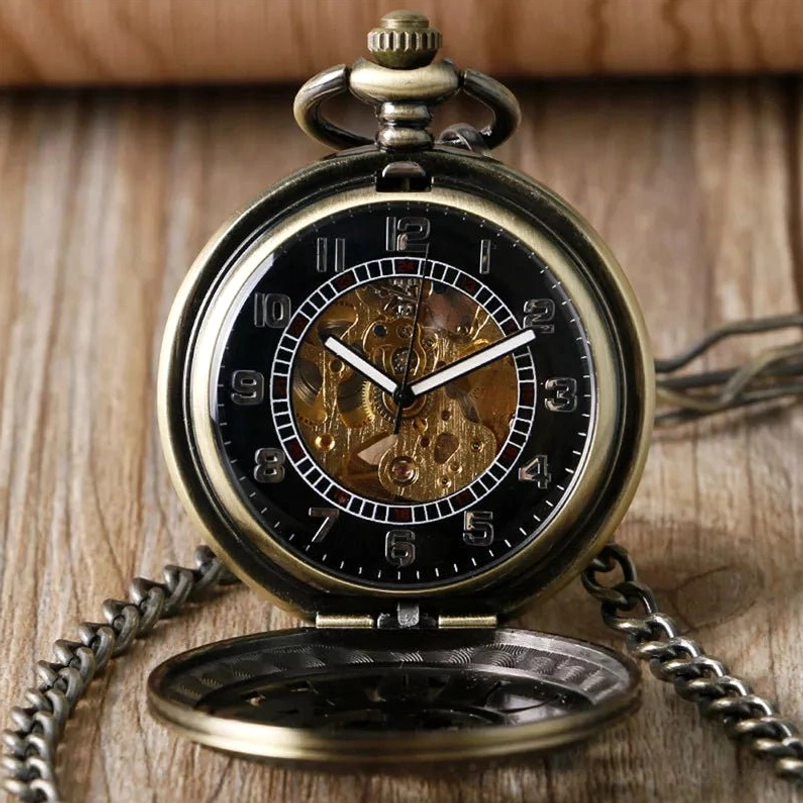 Open steampunk pocket watch displaying exposed mechanical gears, skeleton movement, and black dial with visible clockwork mechanism