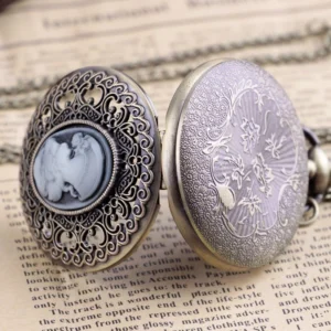 Steampunk pocket watch open case view showing hollow cameo front and engraved floral reverse bronze cover