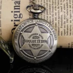 Vintage bronze steampunk pocket watch with sheriff star embossed on back cover, displayed on vintage newspaper backdrop
