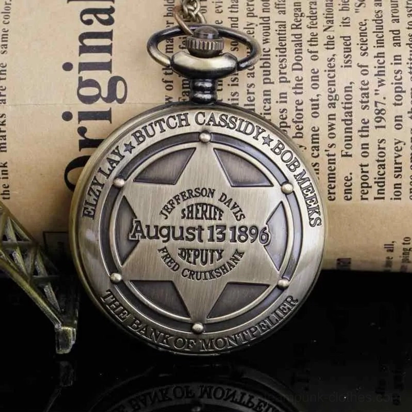 Vintage bronze steampunk pocket watch with sheriff star embossed on back cover, displayed on vintage newspaper backdrop
