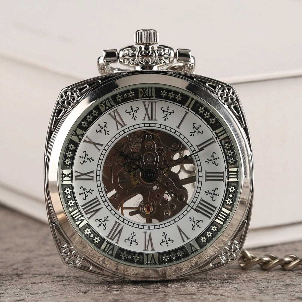 Victorian skeleton steampunk pocket watch front view with roman numeral dial and exposed gear mechanism on textured book background