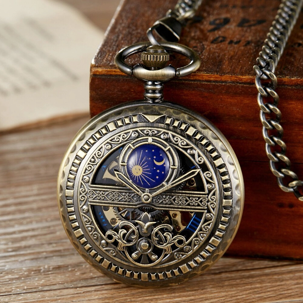 Sun and moon steampunk skeleton pocket watch with bronze engraved floral case, hollowed dial design revealing golden mechanical gears, displayed on vintage wooden desk with aged paper