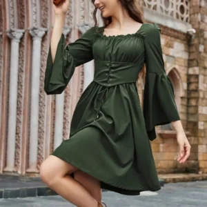 Dark green steampunk princess dress with lace-up corset bodice, metal eyelets, and dramatic bell sleeves on female model in medieval courtyard