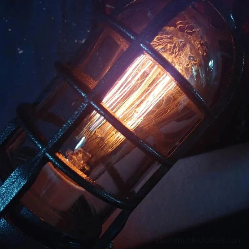 Close-up macro detail of steampunk rocket lamp cage frame interior showing Edison filament bulb construction and metal lattice design