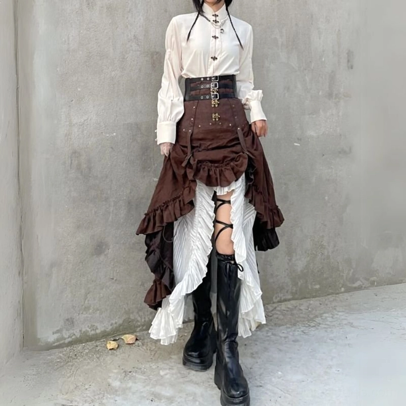 Brown steampunk ruffled skirt with corset waist paired with black tall boots indoor