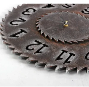 Close-up detail of steampunk clock showing weathered dark brown metal finish, golden central pivot, and vintage numerals
