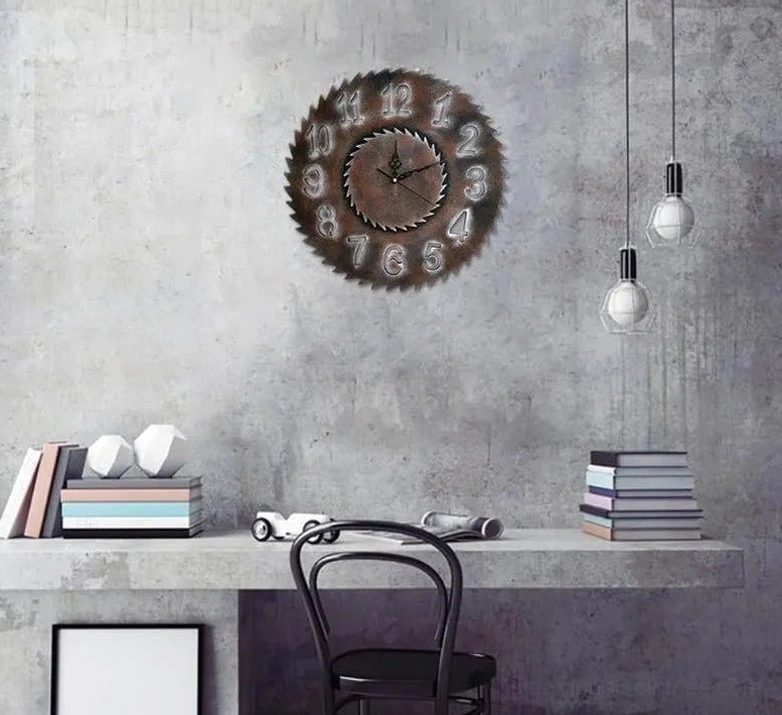 Steampunk saw blade clock displayed on industrial concrete wall with vintage pendant lamps, home office setting