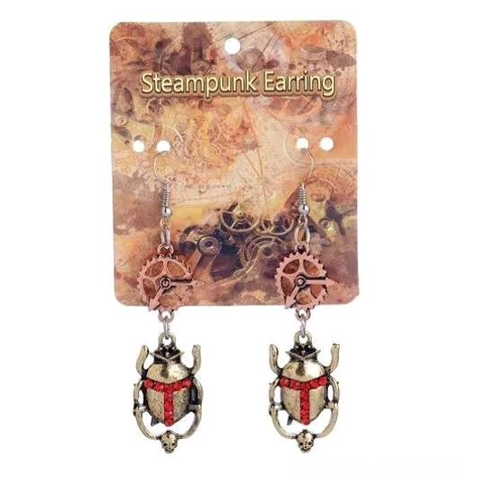 Steampunk scarab beetle earrings on branded card featuring mixed antique metal tones and industrial decor