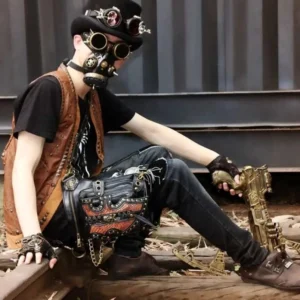 Male steampunk cosplayer wearing Serpento thigh holster bag with vintage brass hardware, gas mask, industrial vest, and complete steampunk festival styling on railway backdrop