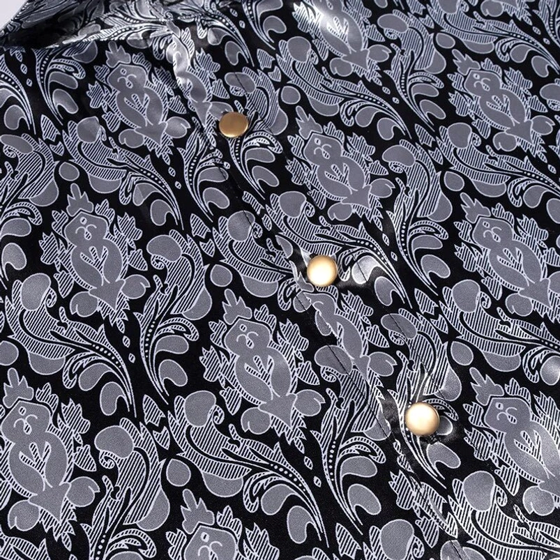 Brass tone button and jacquard damask texture close-up on steampunk shirt placket