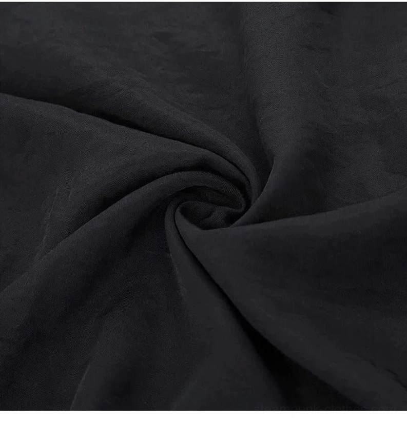 Fabric texture close-up of black steampunk cotton shirt – soft woven weave with drape