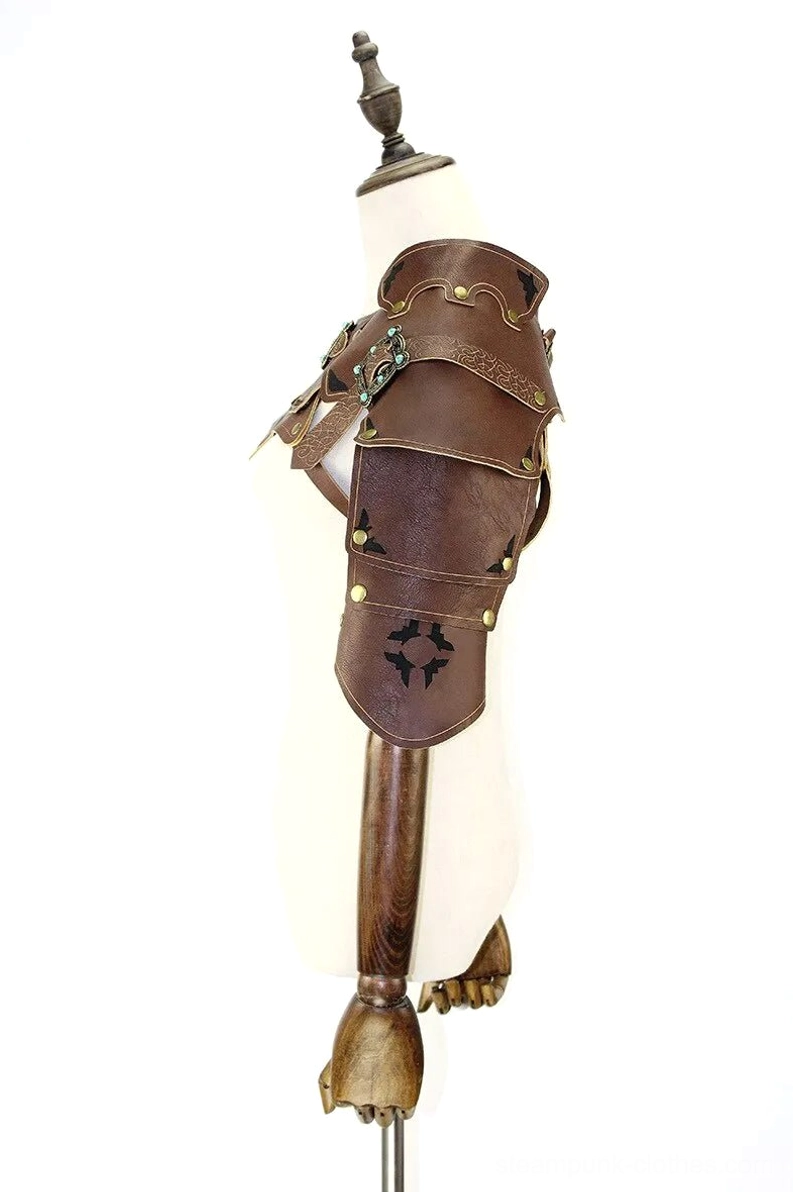 Left side profile view of steampunk leather shoulder armor displaying riveted construction details, carved mechanical patterns, and brass hardware on rich vintage brown leather base