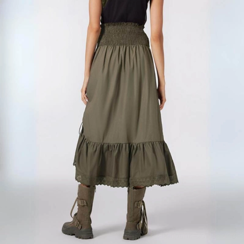 Rear view of army green steampunk skirt showing smocked high waistband and complete ruffled eyelet embroidered lace scalloped hem
