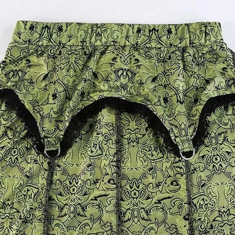 Waist band detail showing elastic construction, black lace trim, and decorative metal ring accents on steampunk skirt