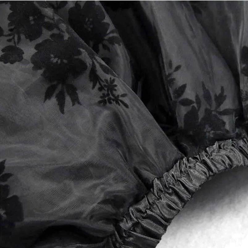 Steampunk skirt extreme close-up of floral flocked organza texture, elasticated waist edge, and sheer mesh material