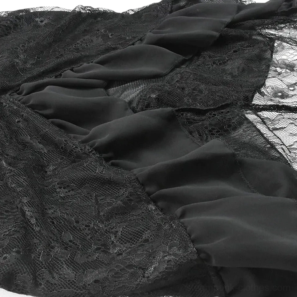 Close-up flat lay of steampunk skirt fabric showing black lace and satin textures with ruched ruffled design detail