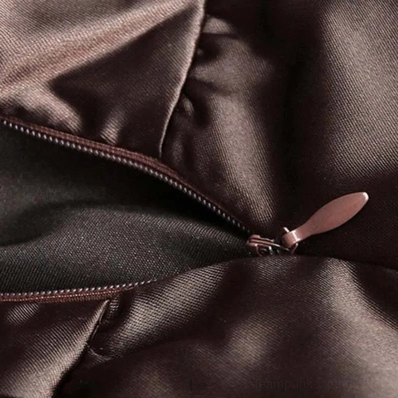 Close-up detail of steampunk skirt showing shiny satin fabric texture, exposed metal zipper closure, and ruffled seam construction