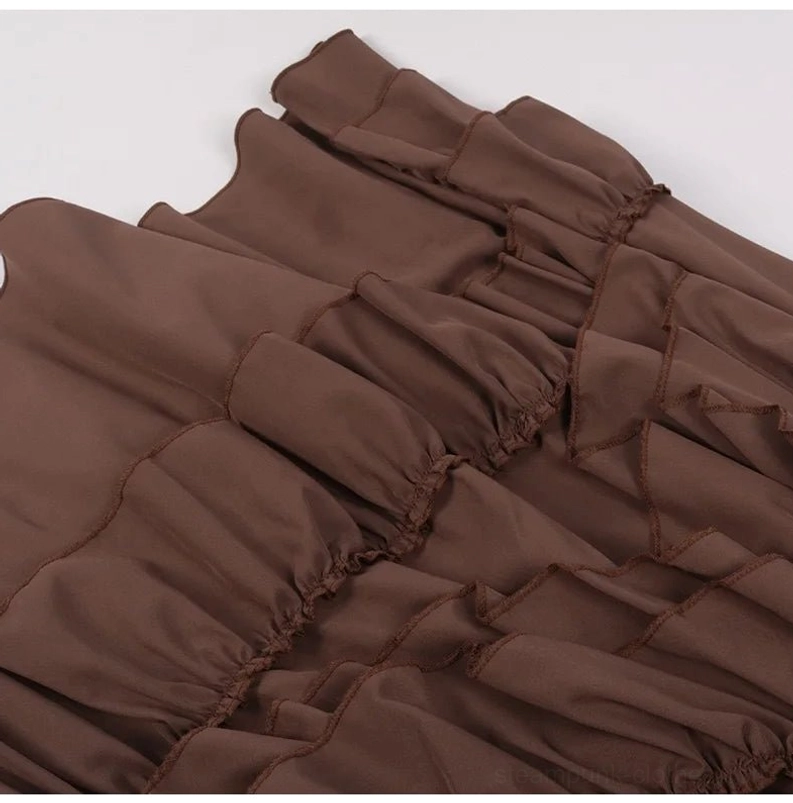 Overhead close-up of ruffled fabric construction on steampunk gathered skirt showing layered stitching and soft drape