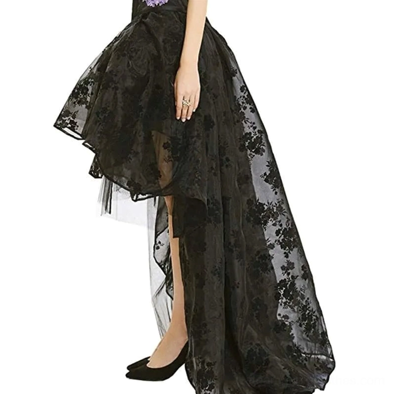 High-low steampunk skirt side three-quarter view displaying flowing mesh train hem and black floral flocking detail