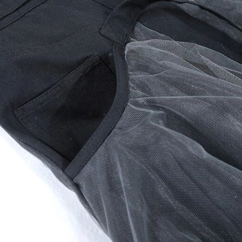 Side view of layered denim mesh steampunk skirt showing soft tulle mesh fabric and structural side pocket