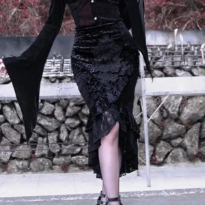 Gothic fishtail trumpet skirt with high-low ruffled hem and floral velvet fabric, side profile view