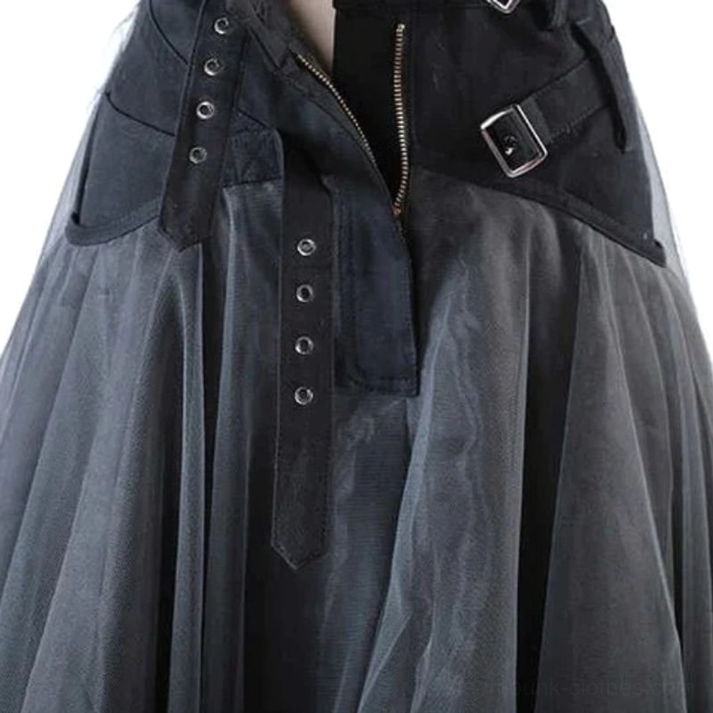 Close-up of steampunk skirt waist featuring metal zipper, exposed button strip, denim pocket and decorative buckle straps