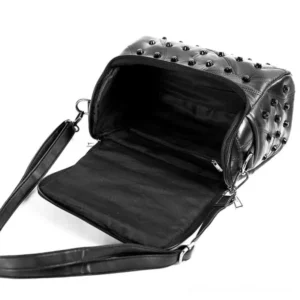 Opened steampunk skull leather bag displaying detachable shoulder strap, interior organization with inner zipper pocket, and authentic black leather interior construction with dual zipper pulls