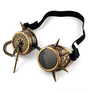 Antique bronze steampunk spike goggles with carved floral patterns and chain dagger charm, left oblique view showcasing spike details