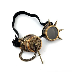 Top-down view of steampunk spiked goggles revealing brass frame with round tinted lenses and decorative chain ornament details