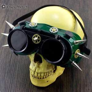 Steampunk spiked goggles front straight view with green frame, silver gears and spikes, black elastic adjustment strap on yellow skull mannequin head