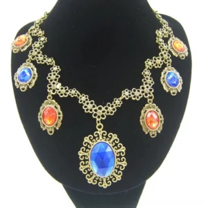 Steampunk statement necklace front view on mannequin featuring antiqued bronze filigree setting with large blue oval pendant and mixed orange-red faceted gemstones
