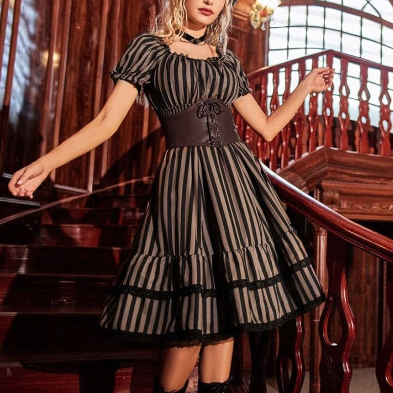 Steampunk striped midi dress with smocked waist, featuring black and white vertical stripes, square neckline, lace trim details, and Victorian-inspired corset design - front three-quarter view on model