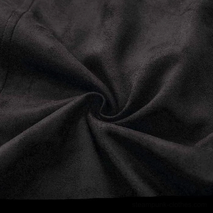 Suede fabric texture close-up showing matte black color and natural wrinkled surface characteristic of premium suede material