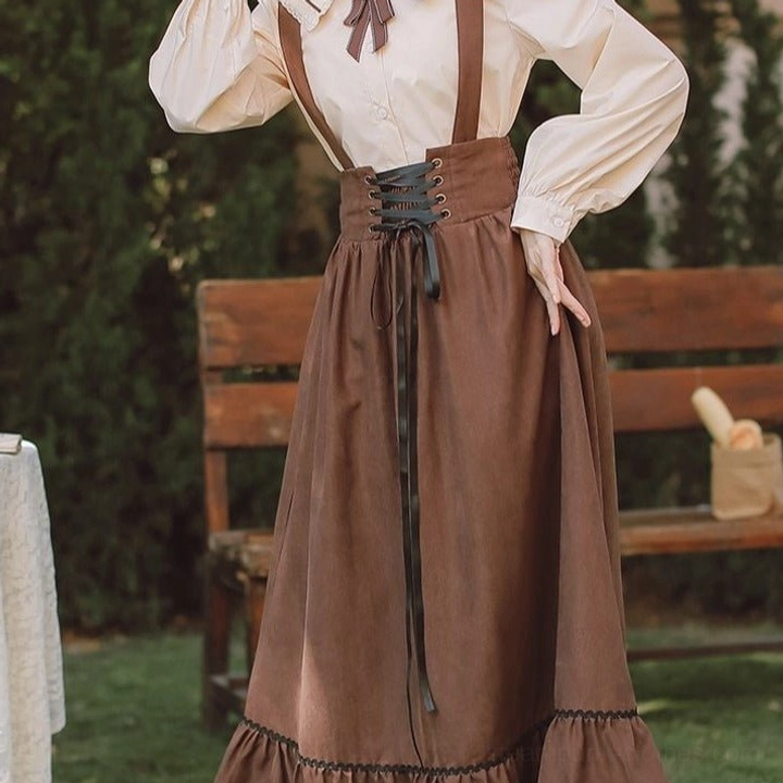 Black lace-up steampunk suspender skirt front view paired with white formal blouse, Victorian aesthetic