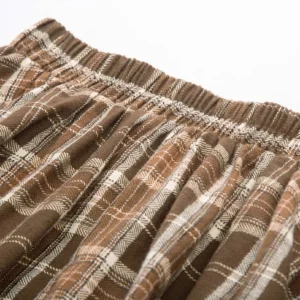 Steampunk plaid midi skirt waist detail elasticated waistband tartan woven texture pleated construction closeup