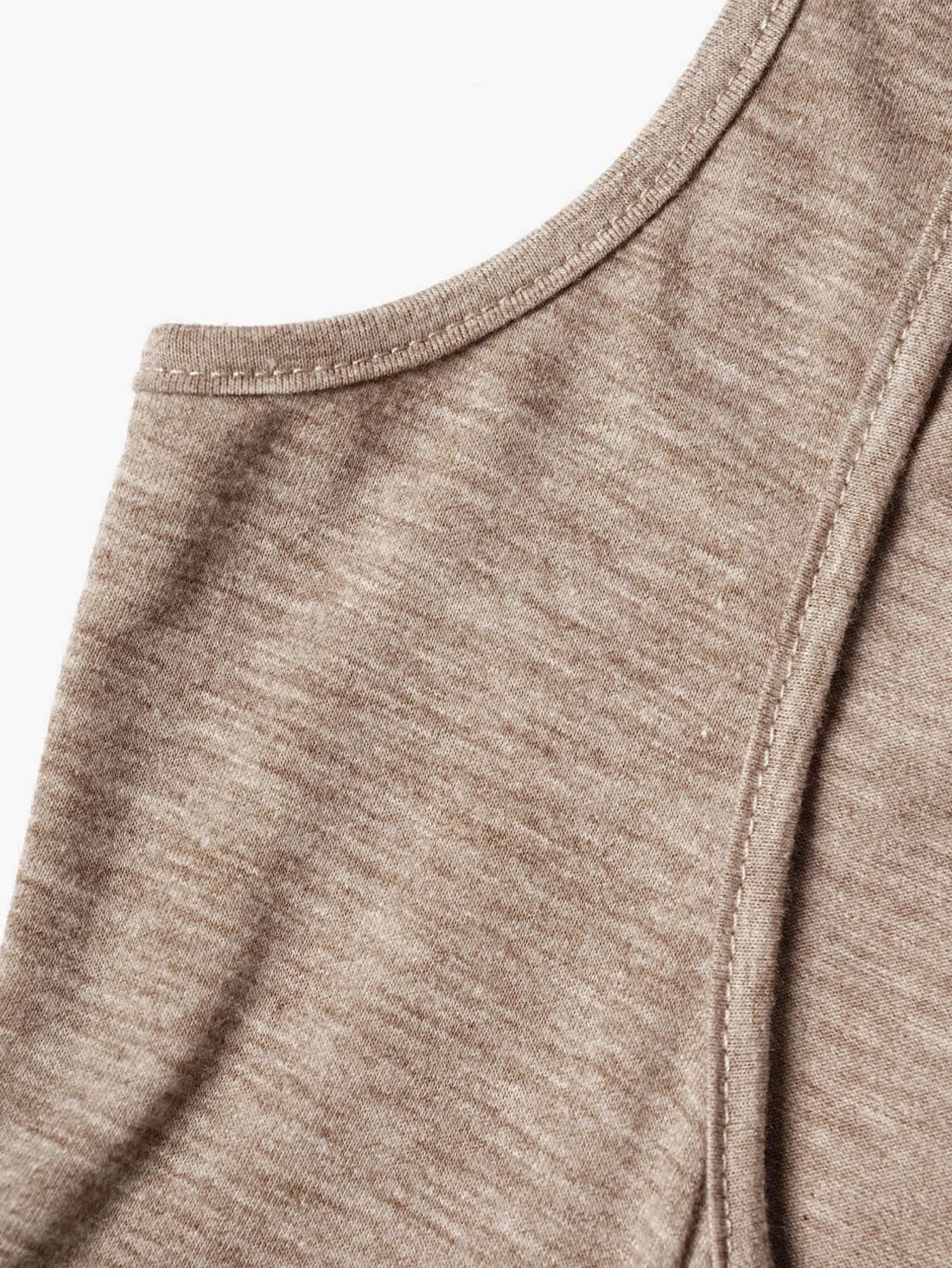 Close-up of steampunk two-piece top fabric texture showing heathered brown knit material with neat seam stitching detail