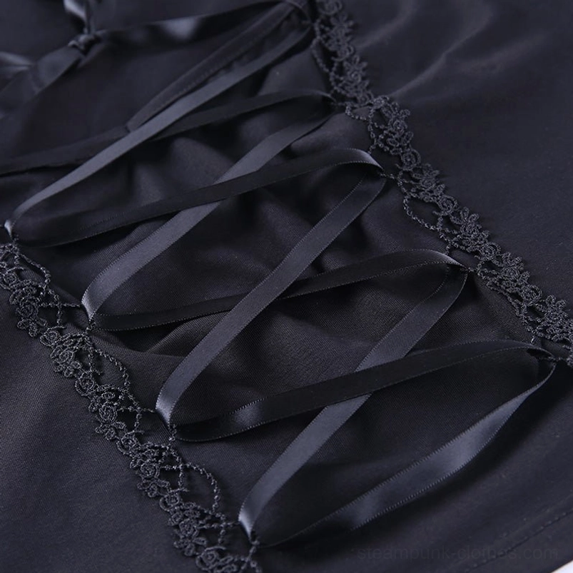 Fabric texture detail showing satin corset lacing, scalloped lace trim, and stretch black fabric construction