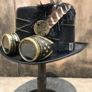 Steampunk top hat with brass goggles left three-quarter view, black felt fabric, gear ornament, and chain accents on wooden stand