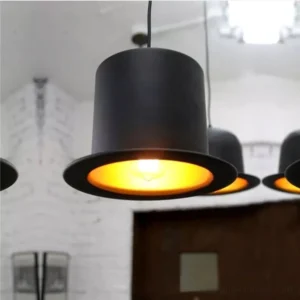 Multiple top hat steampunk pendant lamps grouped together, showcasing warm Edison bulb illumination and Victorian aesthetics