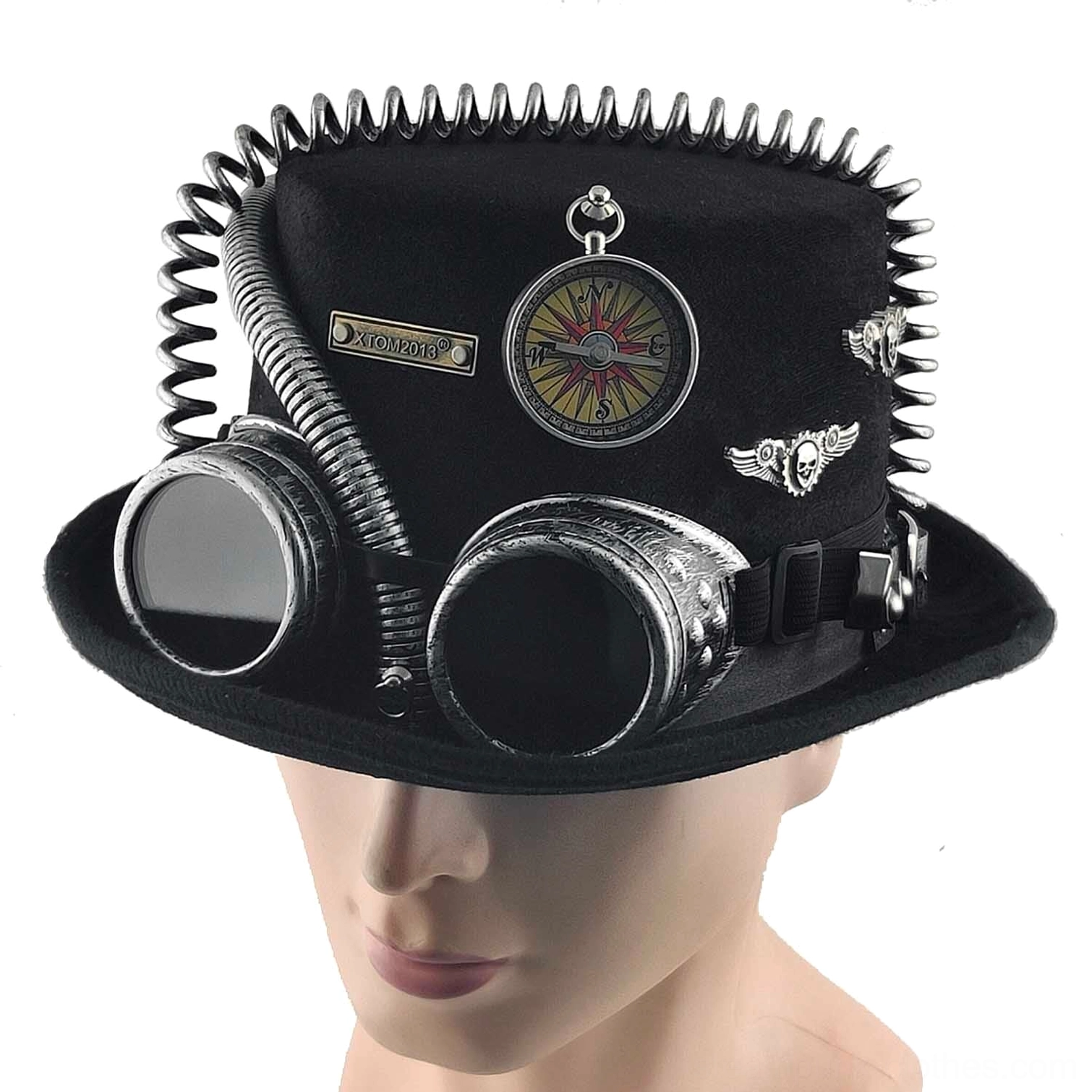 Steampunk hat worn on male mannequin head showing front angle with rivet trim, functional goggles, compass and metal badges