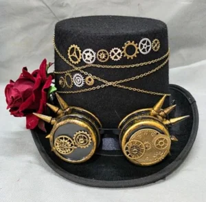 Steampunk top hat with brass goggles and red rose - frontal view showcasing felt fabric, metal gears, and chains on light gray backdrop