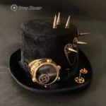 Steampunk spike top hat with attached brass goggles and chain ornaments, three-quarter front view on dark backdrop