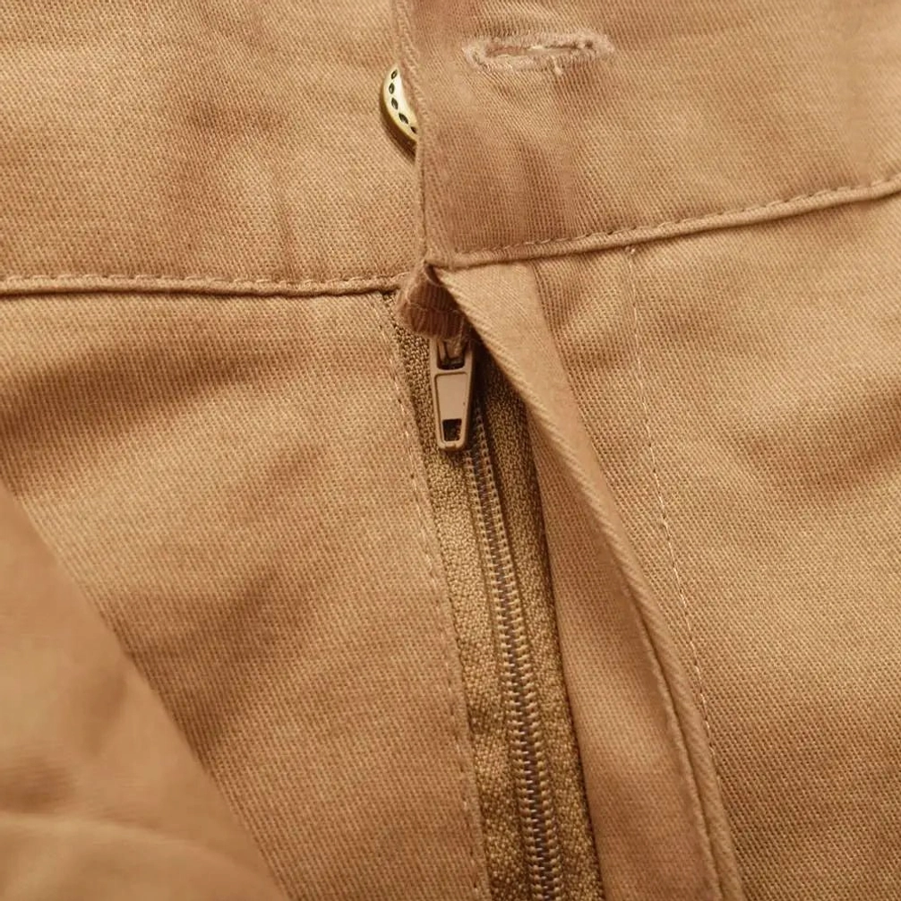 Victorian steampunk trousers metal zipper fly extreme close-up brass hardware authentic detail