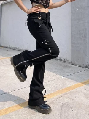 Steampunk cargo pants side profile showing metal eyelet lacing system, side zippers, and industrial hardware - gothic alternative fashion trousers