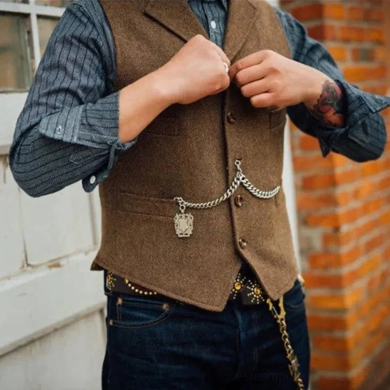 Steampunk tweed waistcoat front view with pocket watch charm chain detail, brick wall background