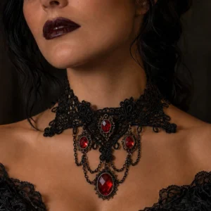Gothic lace vampire choker worn on model - close-up neck view showing black crochet lace, red faceted gems, and vintage bronze metal chain details