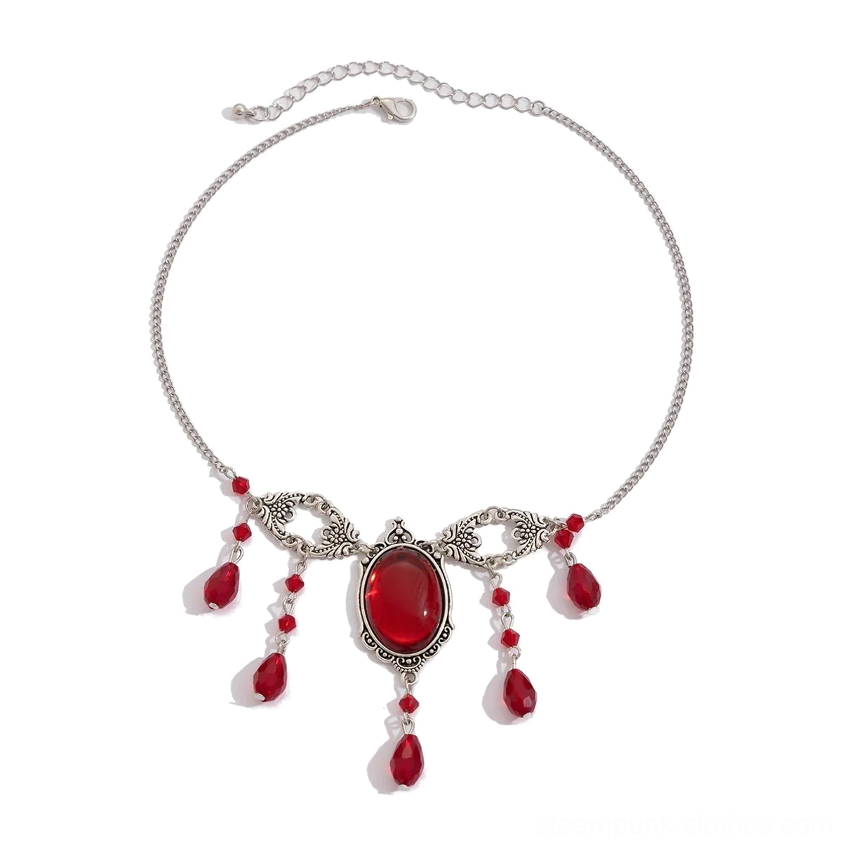 Flat lay detailed view of steampunk vampire necklace showing silver filigree frame, large red oval centerstone, dangling teardrop pendant beads, and adjustable extension chain on white background
