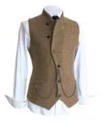 Men's brown tweed steampunk vest with asymmetric placket and metal waist chain on mannequin, front view, steampunk waistcoat Victorian style